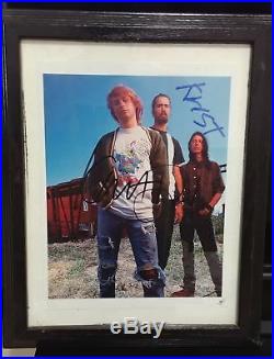 Nirvana photo signed by Kurt Cobain, Krist and Dave